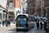 photo of a Nottingham Express Transit tram running on-street